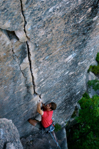 ​Seth Petit getting into the dreamy locks of Emigrant Crack (5.10b), South Wall. Photo by Grant Simmons.