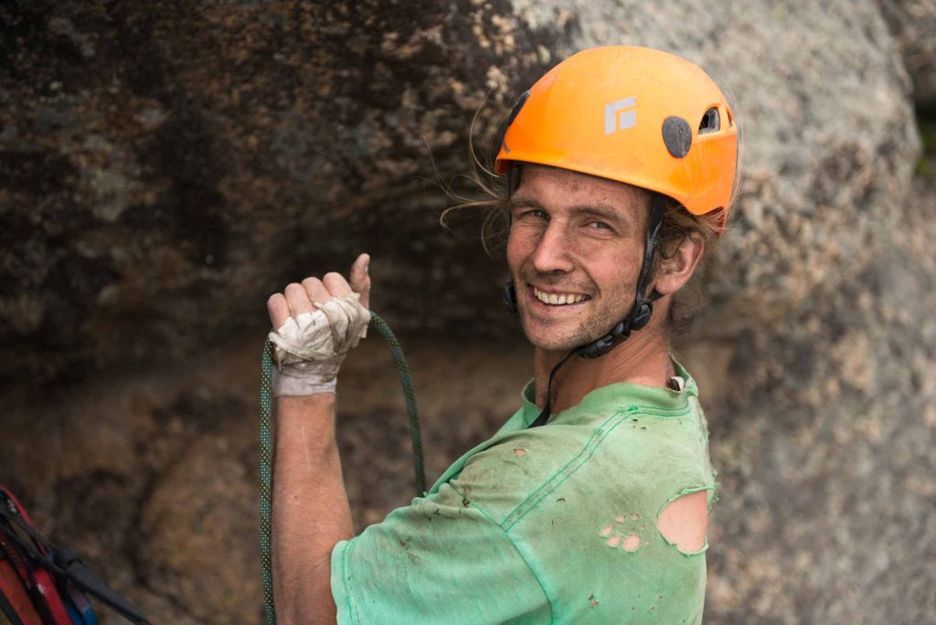 Mike Dobie belays after cleaning a dirty first ascent of Eternal Crack in Keketuohai, China. Photo Garrett Bradley